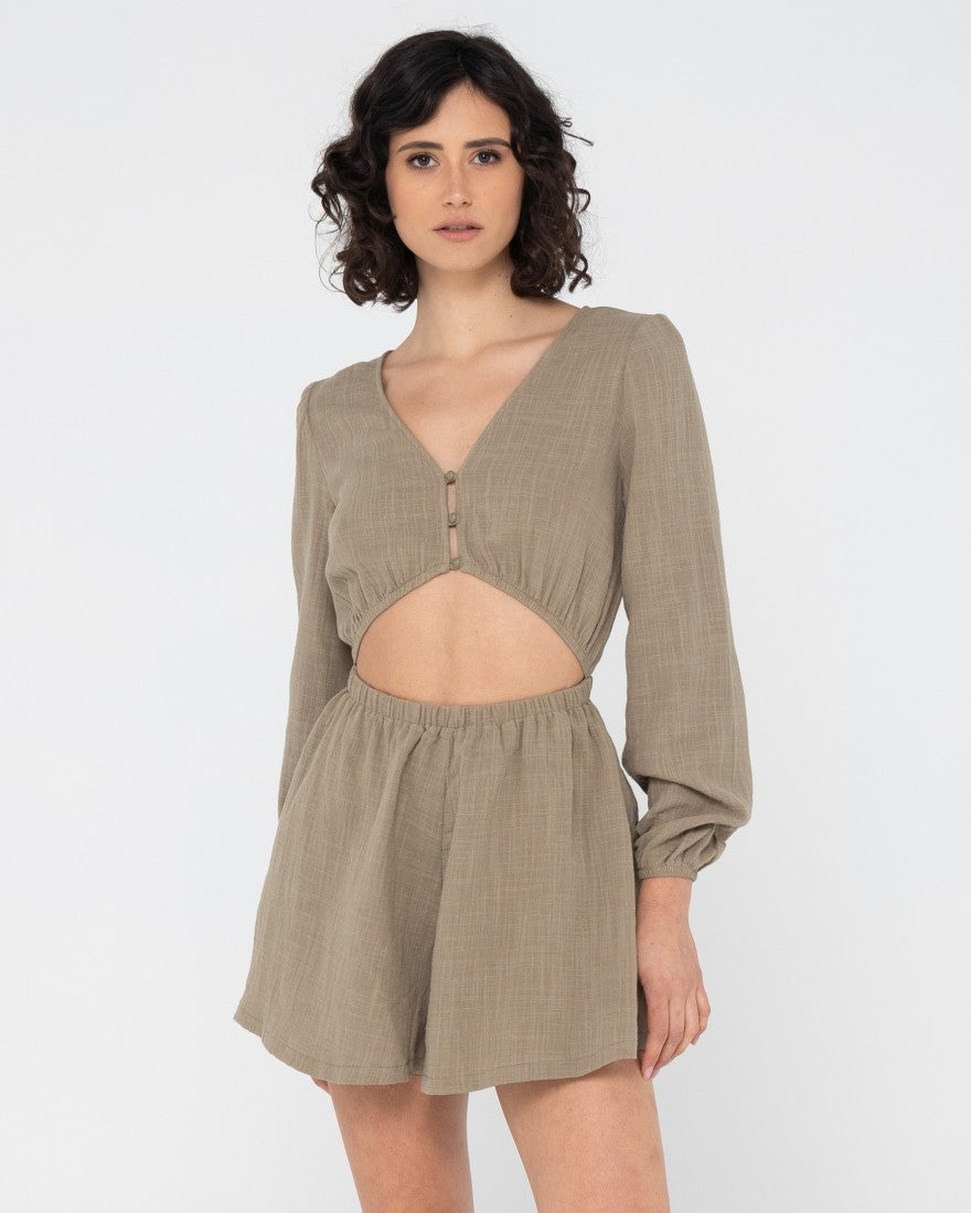 Woman wearing Somewhere Long Sleeve Playsuit in Olive