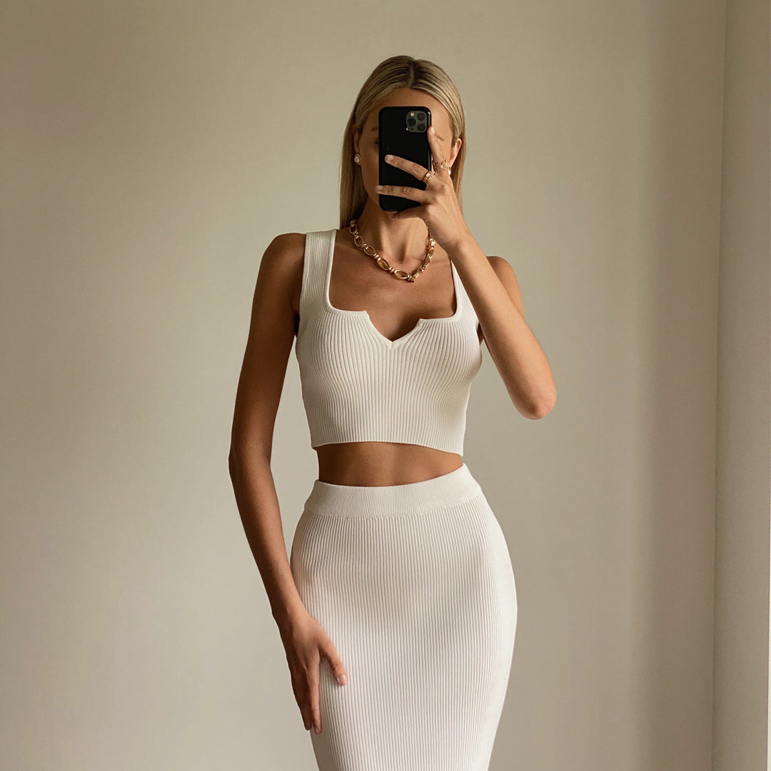 Female model wearing white knit crop top online