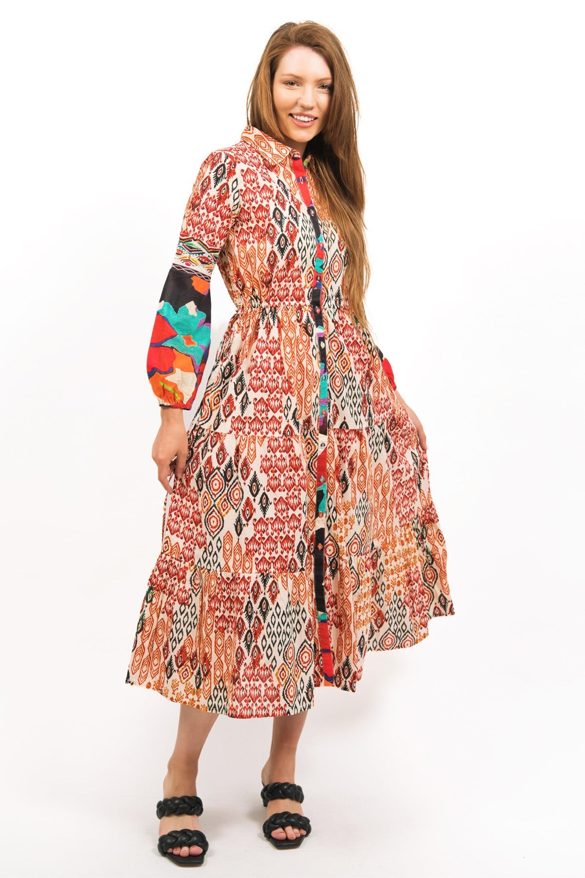 model showing off the flowing TOZI PRINTED TIERED MAXI DRESS with long sleeves and front button opening- zohaonline